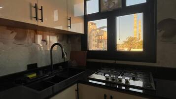 Family Studio, Sea View | Private kitchen | Oven, stovetop