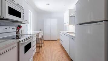 Premium Suite, 2 Bedrooms, City View | Private kitchen | Full-size fridge, microwave, oven, stovetop