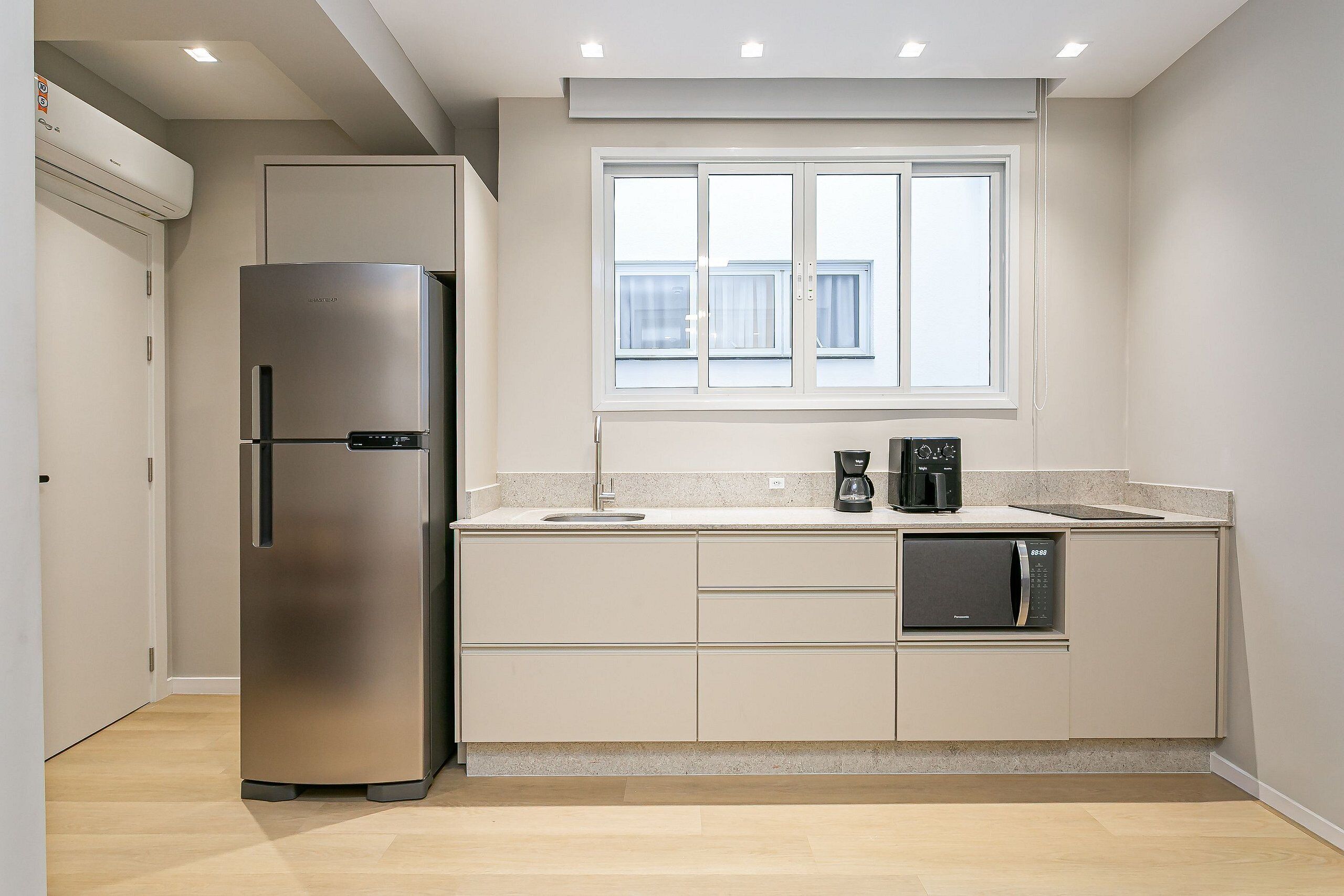 Fridge, coffee/tea maker, toaster, cookware/dishes/utensils