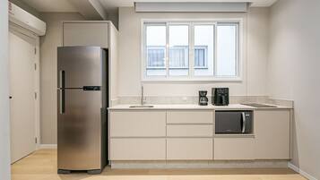 Fridge, coffee/tea maker, toaster, cookware/dishes/utensils