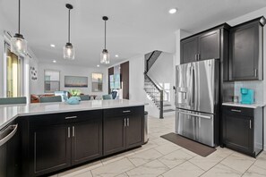 Fridge, microwave, oven, stovetop - Luxury 4BR/5BA Beach Retreat w/ Pool and Grill (Melbourne Beach)