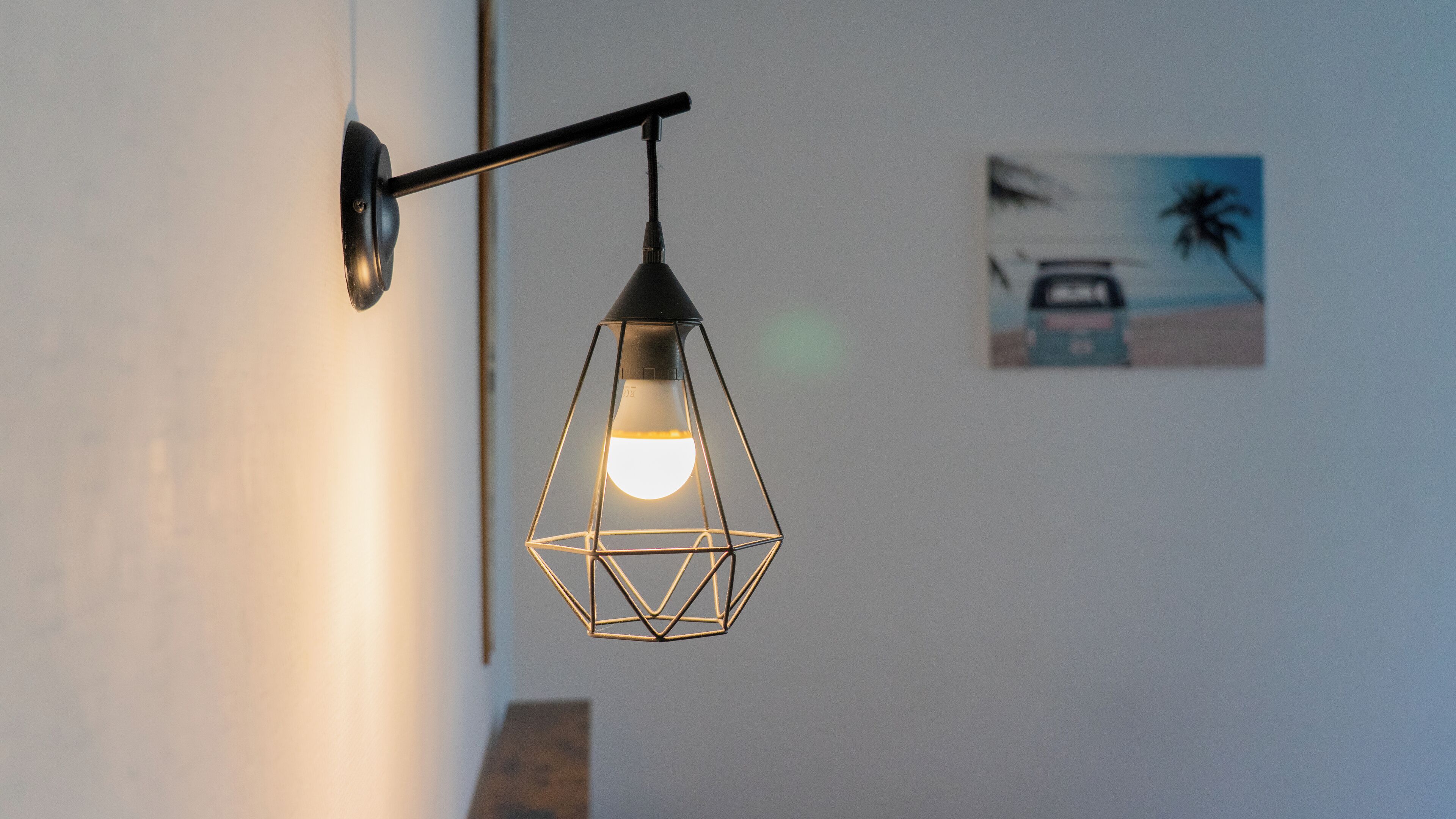 A wall-mounted light fixture with a geometric design.