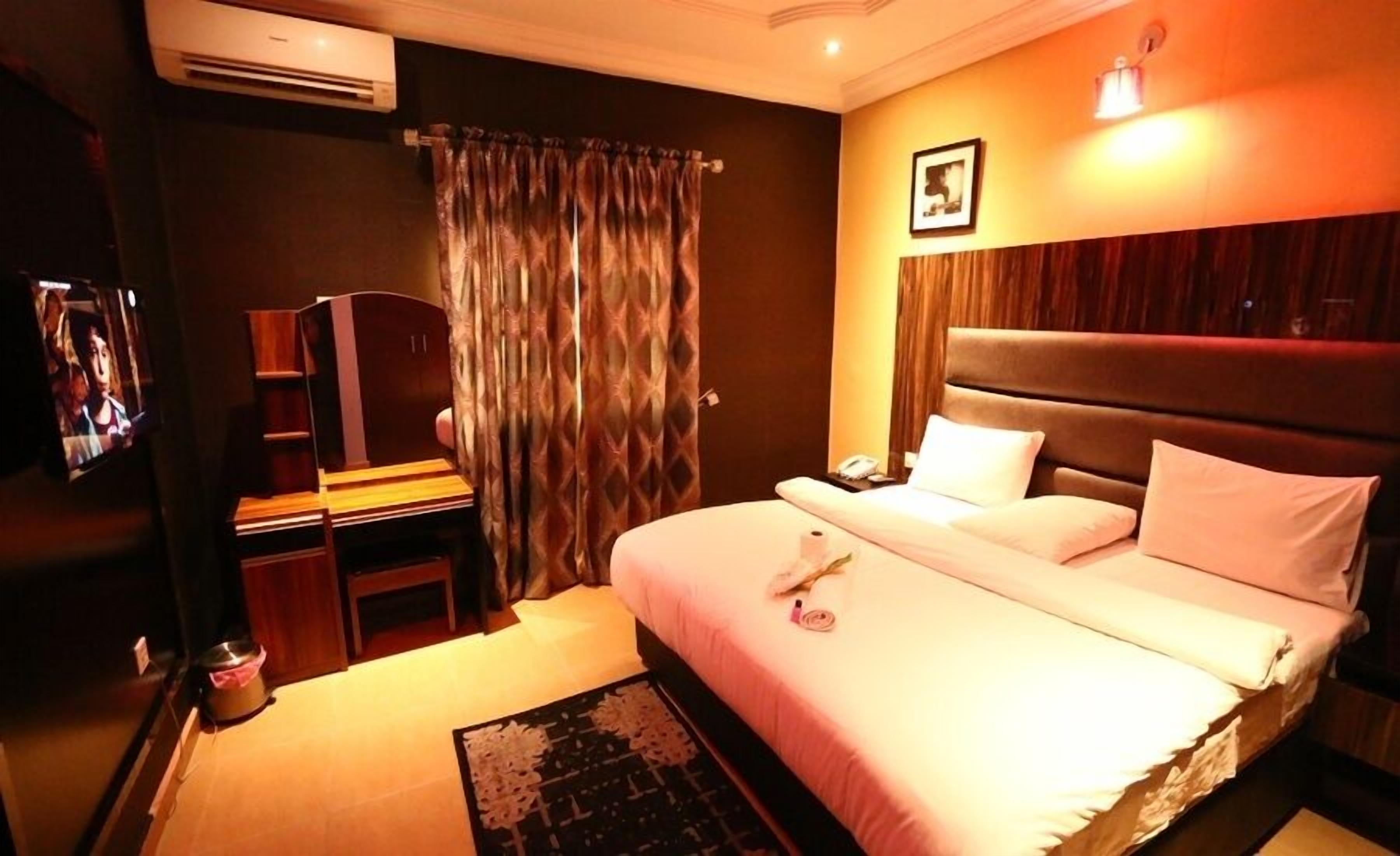 Deluxe Apartment, Balcony, City View | Desk, laptop workspace, blackout drapes, soundproofing