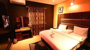 Deluxe Apartment, Balcony, City View | Desk, laptop workspace, blackout drapes, soundproofing