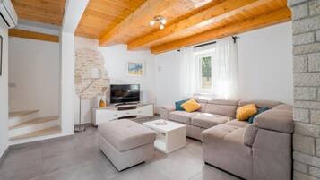 House (Three bedroom villa) | Living room | 32-inch flat-screen TV with satellite channels, video game console