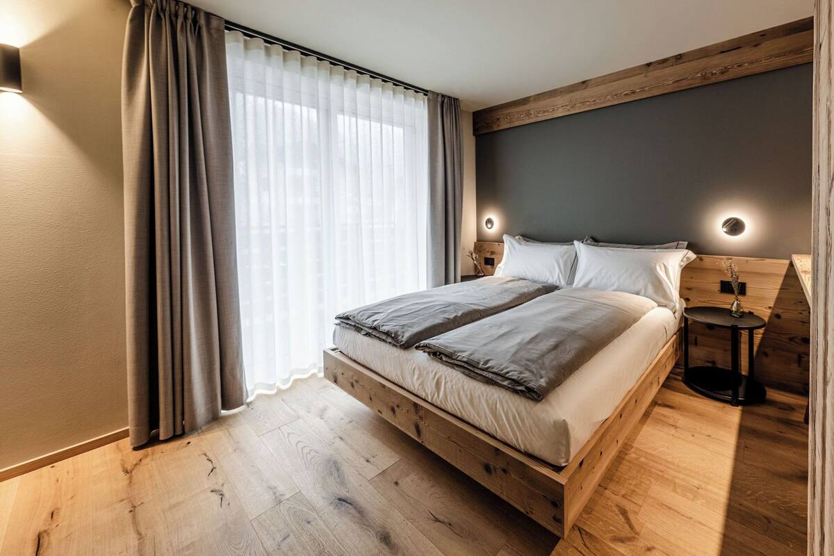 Premium bedding, down comforters, blackout drapes