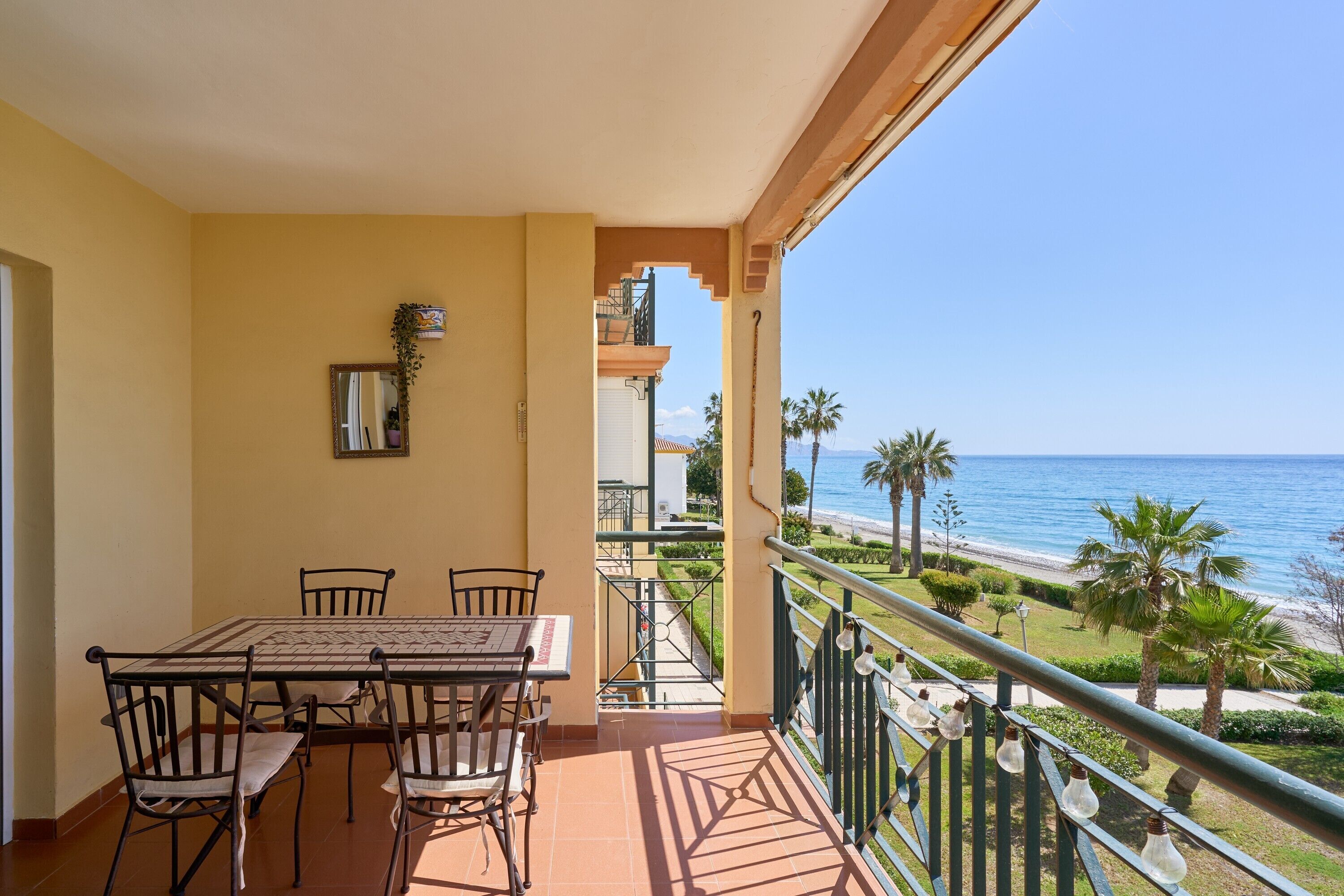 Outdoor dining. Firstline Beach By Ist Apartment – Directly on Peñoncillo Beach, Torrox Costa