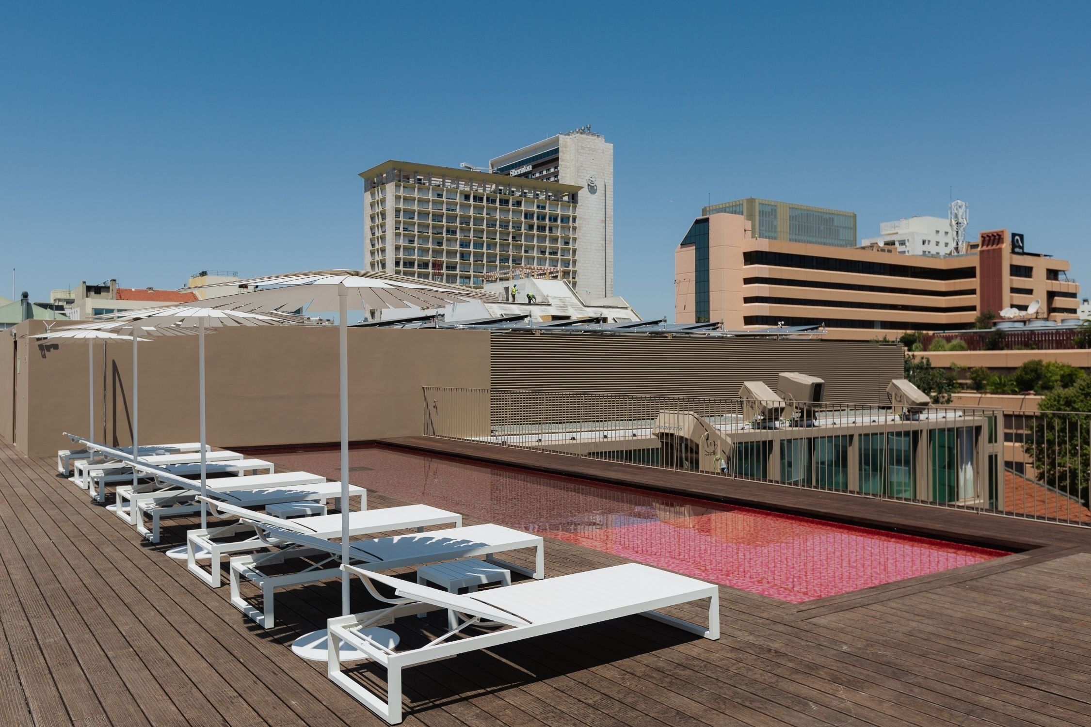 Dive into a stunning rooftop pool with skyline views.