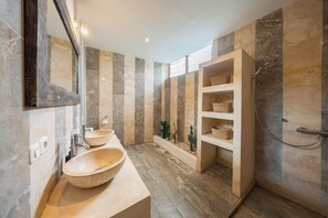 A modern bathroom with two sinks, a shower, and a built-in shelf with baskets. - Stylish 4BR Canggu Villa • Private Pool & Sundeck • 8 Min to Beach (Badung Regency)