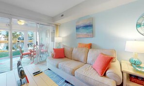 TV, fireplace, books - Coastal Townhome | Sunroom, Near Beach & Bay (Selbyville)