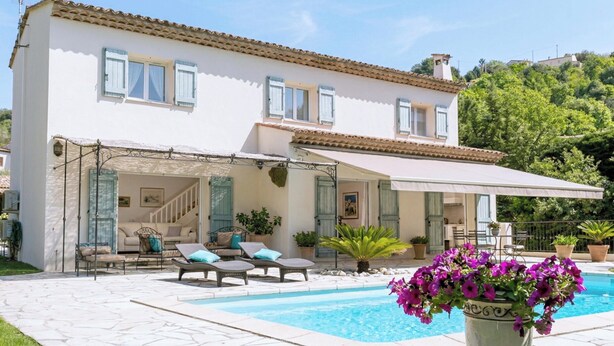 A two-story house with a swimming pool, outdoor seating, and potted plants. - CASA-Noel villa avec piscine privée (Saint-Paul-de-Vence)