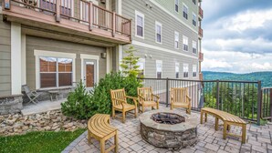 A patio with outdoor seating, a fire pit, and a view of a mountainous landscape. - Soaring Eagle #201: 3 Bedrooms, 2 Full Baths: Slope Side (Snowshoe)