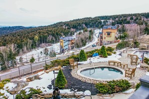 A residential area with a swimming pool, outdoor furniture, and a view of a forested hill. - 3 Bedroom, 2 Full Baths, Slope Side. Outdoor Hot Tubs on Site. Ski Lift Overlook (Snowshoe)