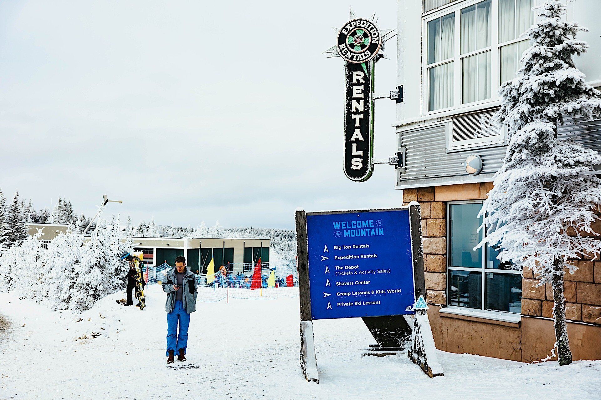 A signboard for Big Top Rentals with a list of services including Expedition Rentals, The Depot, Shavers Center, Group Lessons & Kids World, and Private Ski Lessons.