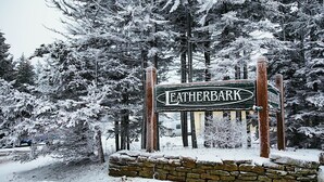 A snow-covered sign for Leatherbark. - Leatherbark - 301b, 2 Bedroom Allegheny Sunrise Spacious Condo Foosball (Snowshoe)