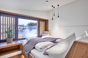 Spa - Modern design apartment with a view of the Dreisesselberg.<br>With sauna, roof terrace, outdoor bathtub and custom-made furnishings.<br>Perfect for two adults who appreciate peace and quality. (Breitenberg)