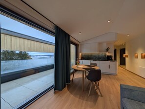Dining - Modern design apartment with a view of the Dreisesselberg.<br>With sauna, roof terrace, outdoor bathtub and custom-made furnishings.<br>Perfect for two adults who appreciate peace and quality. (Breitenberg)