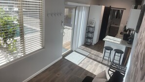 A modern kitchen with a built-in oven, a coffee machine, and a "No Smoking" sign. - Unique 1-bdrm poolhouse with 24hr access to Pool & Jacuzzi (Phoenix)