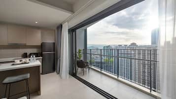 Room, 1 Queen Bed, City View | Living area | 55-inch Smart TV with digital channels