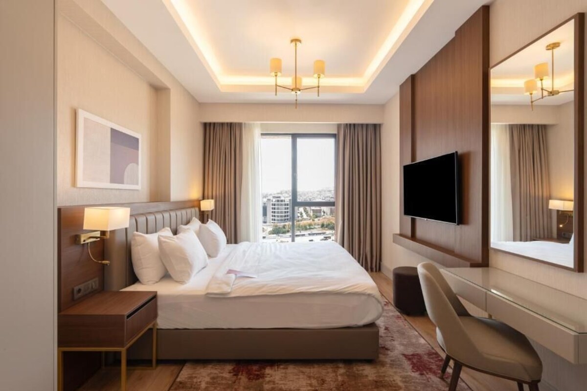 Luxe beddengoed, een minibar, een kluis op de kamer, een laptopwerkplek