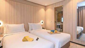 Deluxe Twin Room, City View | Individually decorated, individually furnished, desk, blackout drapes