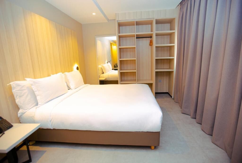 Luxury Suite, City View | Desk, blackout curtains, soundproofing, iron/ironing board