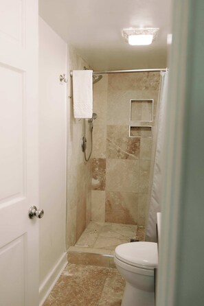 Shower, hair dryer, towels, shampoo