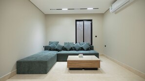 75-inch Smart TV with cable channels, Netflix, streaming services - Luxury two bedroom Apartment Al Rawdha (Riyadh)