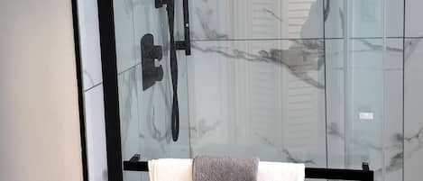 Shower, hair dryer, towels, soap