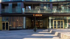 A modern building with a prominent entrance labeled "FORUM." - City center with Free parking and Sauna (Tallinn)