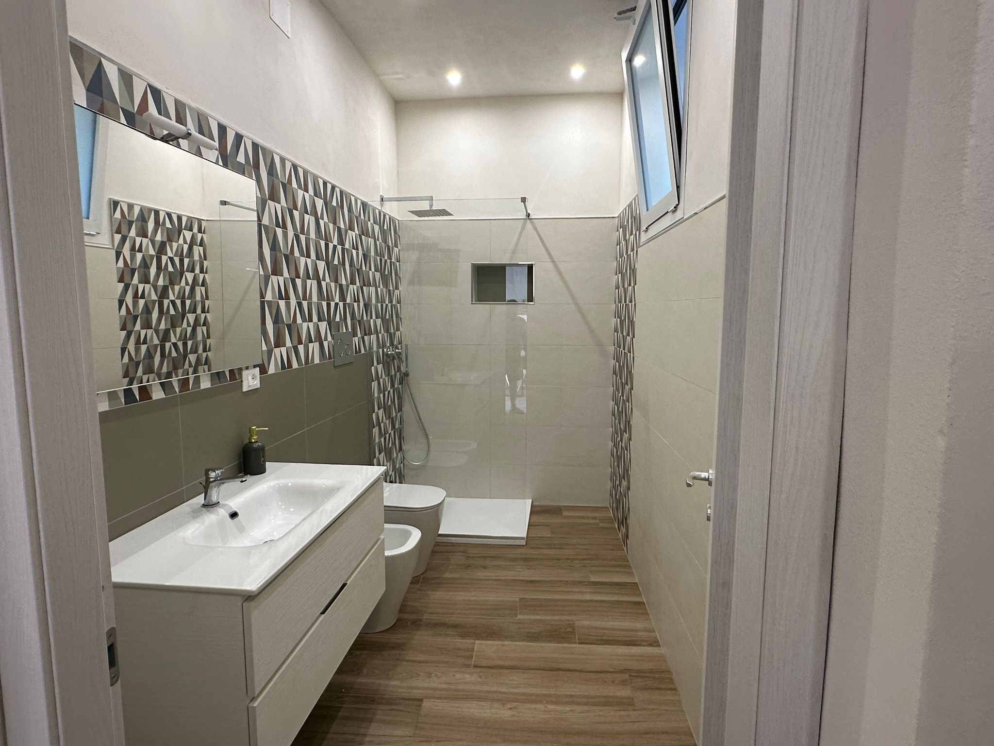 Deluxe Apartment, Patio | Bathroom | Shower, hair dryer, towels, soap