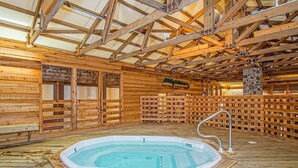 An indoor wooden cabin with a hot tub, wooden walls, and a high ceiling. - 2 Br: Snowcrest 214a 2 Bedroom: Indoor Hot Tubs Game Room Easy Slope Access (Snowshoe)