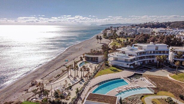 A coastal hotel with a pool, beach access, and a view of the ocean. - TE- Luxury Resort, Front Line Beach, Families Only (Estepona)