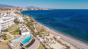 A coastal hotel with a pool, beach access, and a view of the ocean. - TE- Luxury Resort, Front Line Beach, Families Only (Estepona)