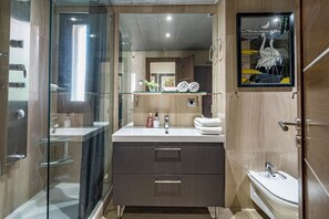 A modern bathroom with a glass-enclosed shower, a vanity with a mirror, and a toilet. - Bp7c2a Beachfront Penthouse With Private Pool (Estepona)