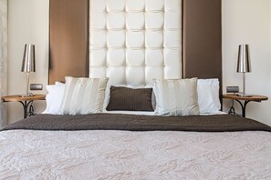 A large bed with a tufted headboard, two bedside tables, and a brown quilted bedspread. - Bp7c2a Beachfront Penthouse With Private Pool (Estepona)