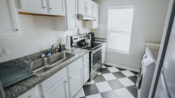 Fridge, oven, cookware/dishes/utensils, dining tables