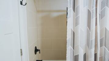 Shower, towels, soap, toilet paper