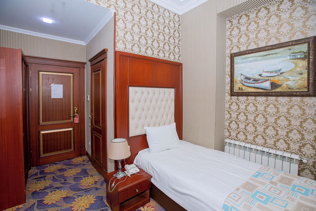 Comfort Single Room, City View | In-room safe, desk, laptop workspace, iron/ironing board