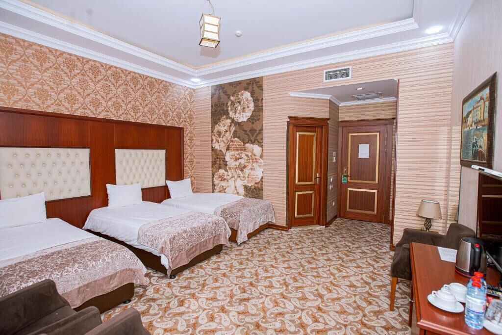 Comfort Triple Room, City View | In-room safe, desk, laptop workspace, iron/ironing board