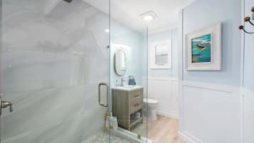 Shower, hair dryer, towels, shampoo