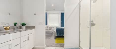 Shower, hair dryer, towels, toilet paper