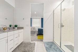 Shower, hair dryer, towels, toilet paper