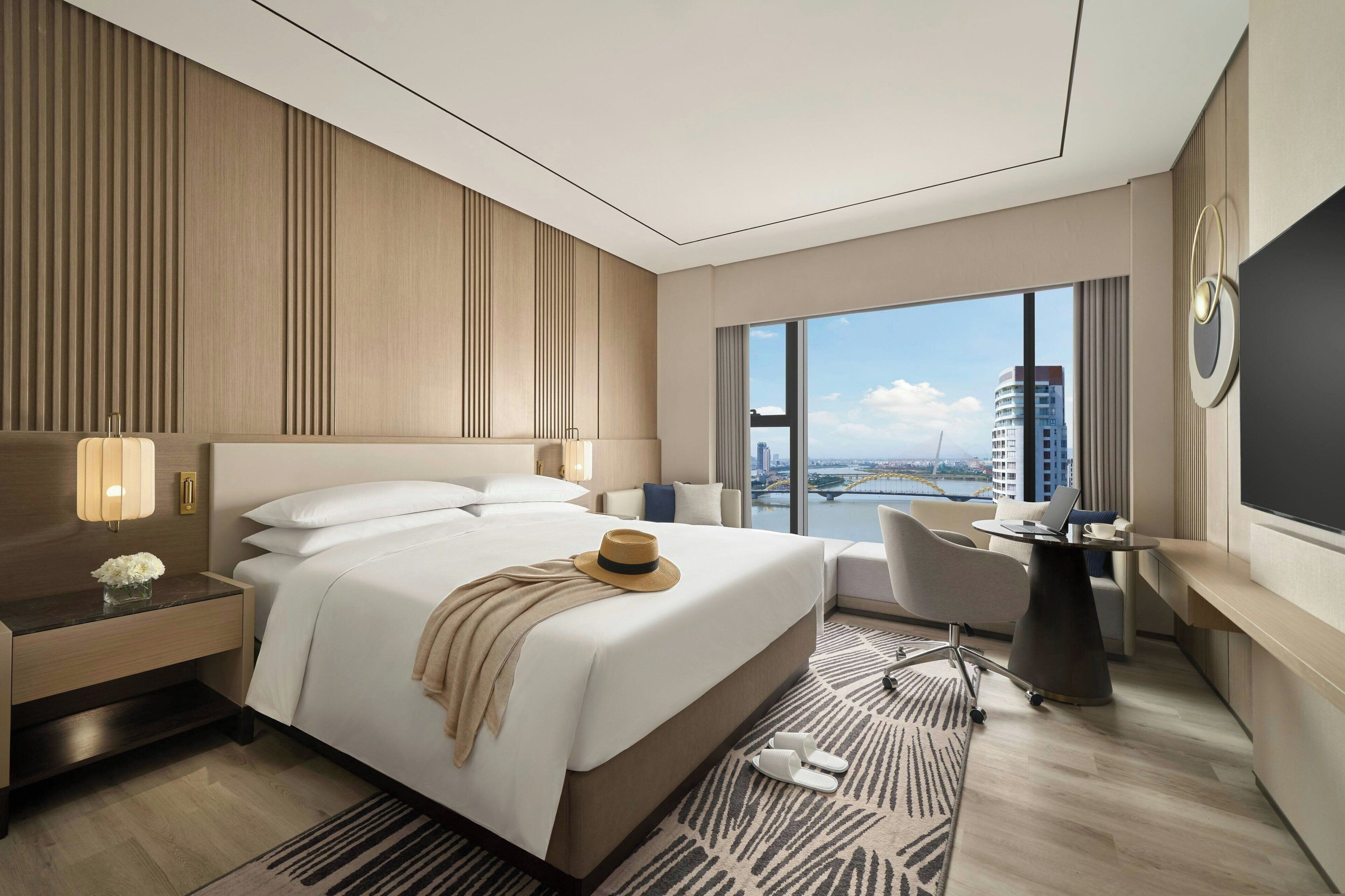 Apartment, 1 Bedroom, River View | Laptop workspace, iron/ironing board, bed sheets