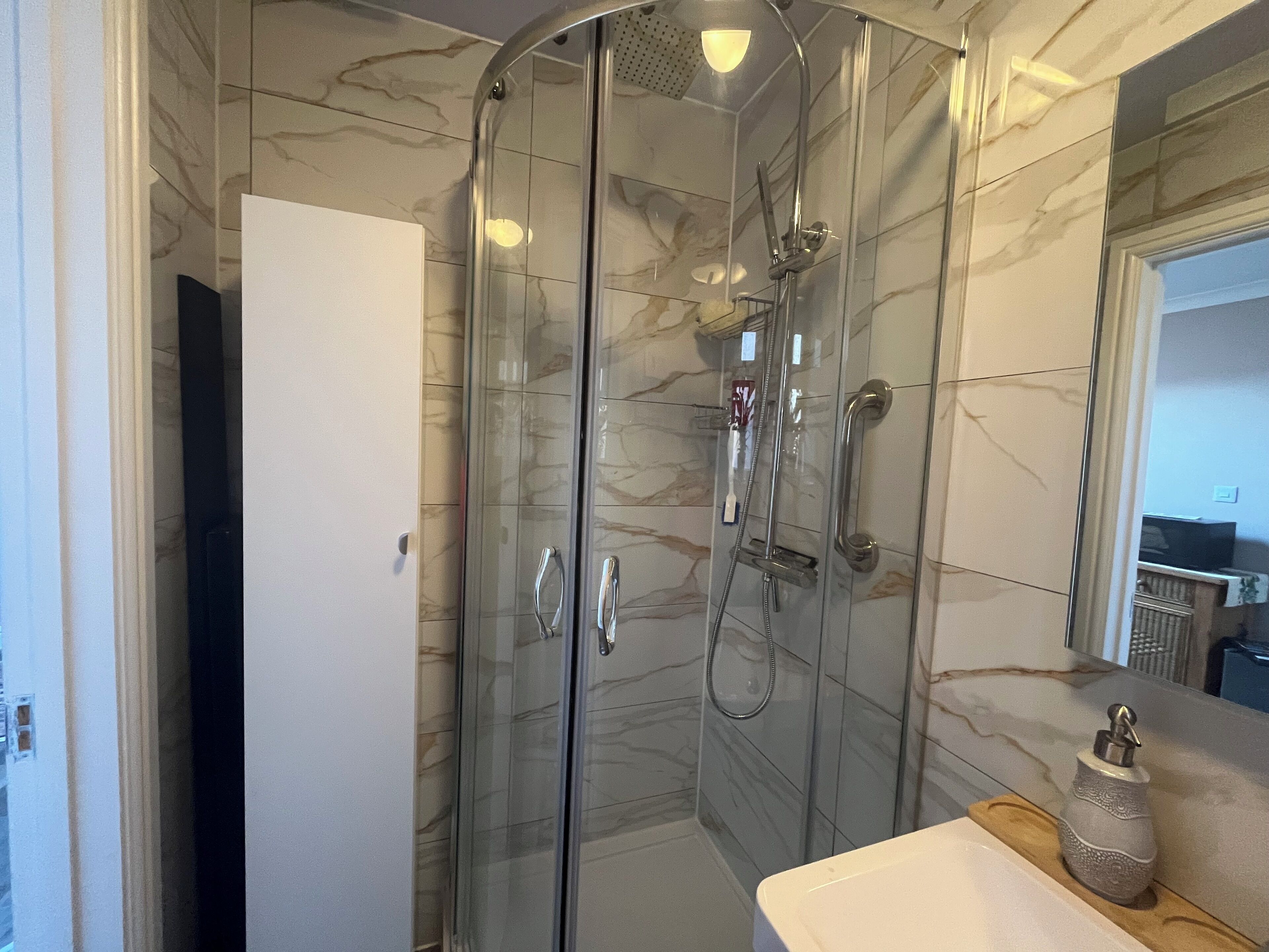 Shower, hair dryer, towels, soap