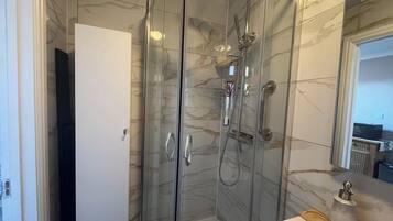 Shower, hair dryer, towels, soap