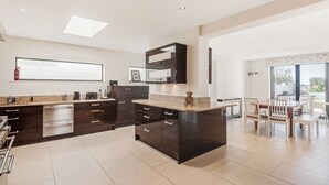 Coffee/tea maker, fridge, dishwasher, highchair