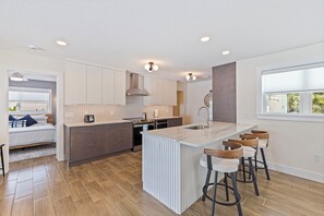 Fridge, microwave, oven, stovetop - 370 Turtle Cove – Waterfront Luxury w/ Heated Pool, Fire Pit, Bikes & Walk to Beach (Indian Rocks Beach)