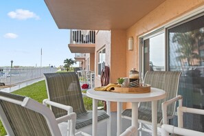 Outdoor dining - Ground‑Floor Patio Walkout W/ Steps to the Heated Pool & Private Beach Access🌴 (Cocoa Beach)