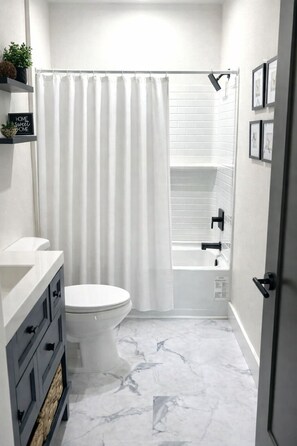 Shower, hair dryer, towels, soap - Modern 2BR/2BA Furnished Home w/Dedicated Workspace & Fast WIFI Seminole Heights (Tampa)